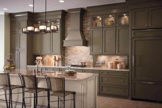 Inspiration for a large transitional single-wall open plan kitchen in Denver with an undermount sink, recessed-panel cabinets, green cabinets, quartz benchtops, beige splashback, ceramic splashback, ceramic floors, with island and panelled appliances.