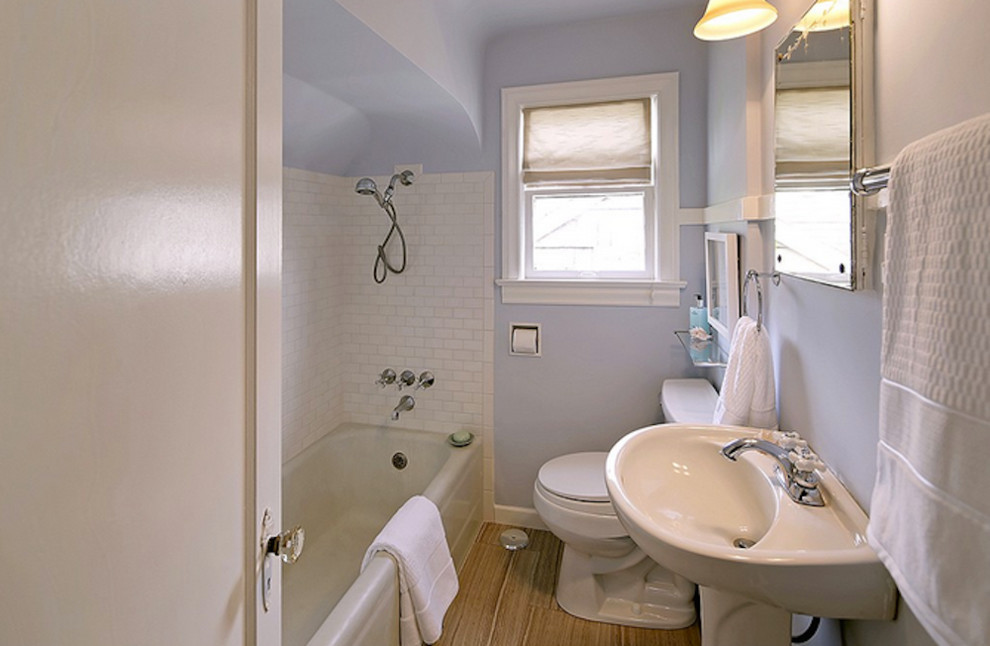 Design ideas for a small contemporary kids bathroom in Seattle with a corner tub, a corner shower, a one-piece toilet, white tile, subway tile, purple walls, porcelain floors and a pedestal sink.
