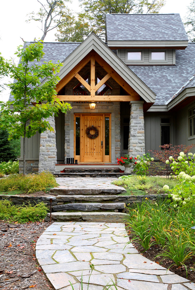 Inspiration for a country two-storey grey exterior in Vancouver with a gable roof.