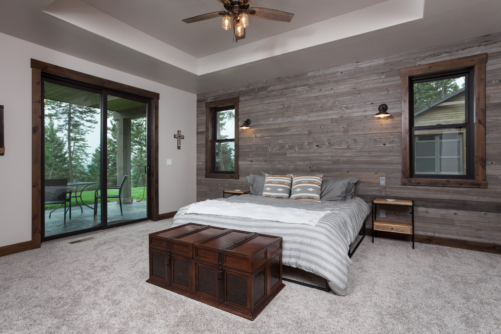 Mountain style master carpeted and beige floor bedroom photo with white walls