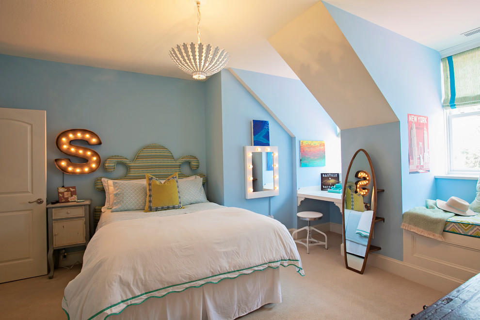 Photo of a large beach style kids' room for girls in Atlanta with blue walls and carpet.