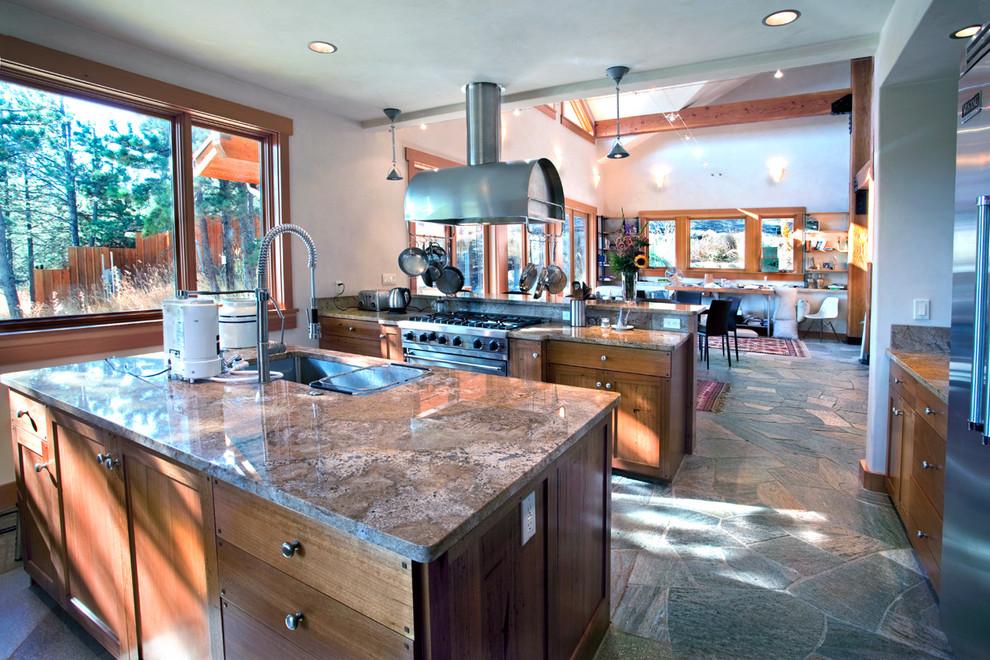 Example of a large mountain style u-shaped slate floor and multicolored floor open concept kitchen design in Denver with an undermount sink, shaker cabinets, medium tone wood cabinets, soapstone countertops, multicolored backsplash, stone slab backsplash, stainless steel appliances and two islands