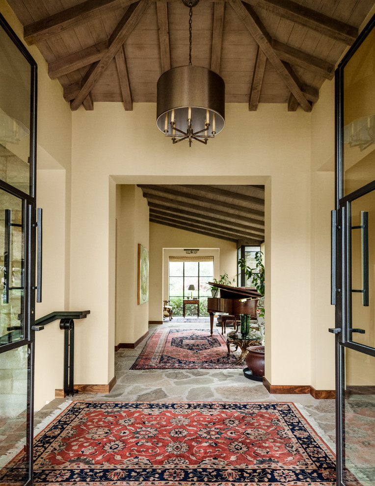 This is an example of a mediterranean entryway in Dallas.