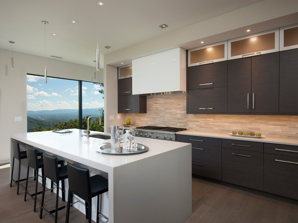 This is an example of a contemporary galley kitchen in Other with an undermount sink, flat-panel cabinets, dark wood cabinets, beige splashback, stainless steel appliances, dark hardwood floors and with island.