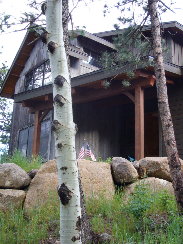 Mountain style home design photo in Denver