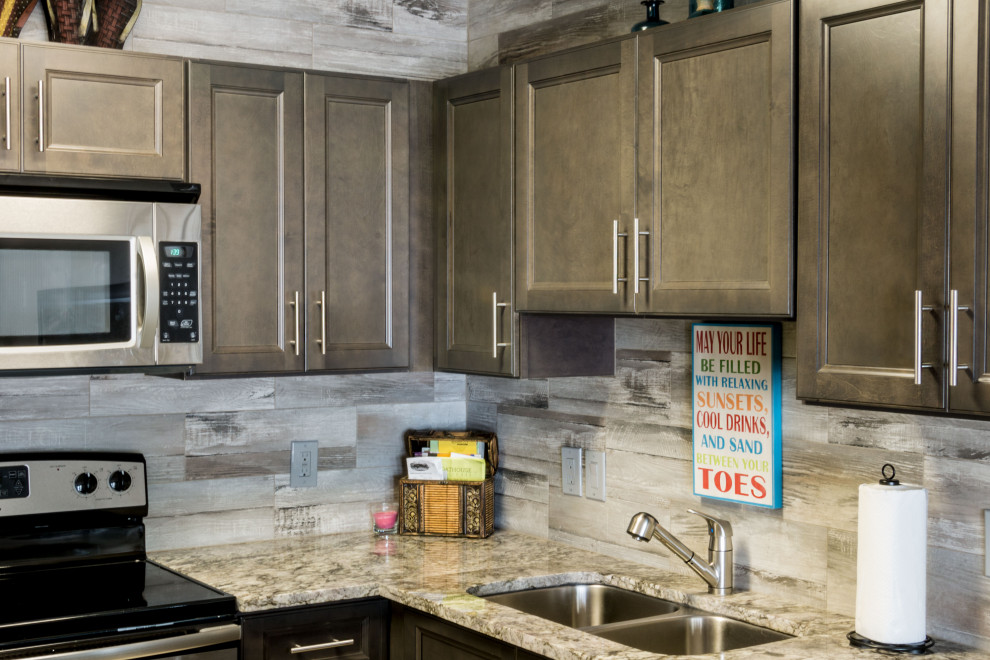 Small mountain style u-shaped cement tile floor and beige floor eat-in kitchen photo with an undermount sink, flat-panel cabinets, medium tone wood cabinets, granite countertops, gray backsplash, ceramic backsplash, stainless steel appliances, a peninsula and gray countertops