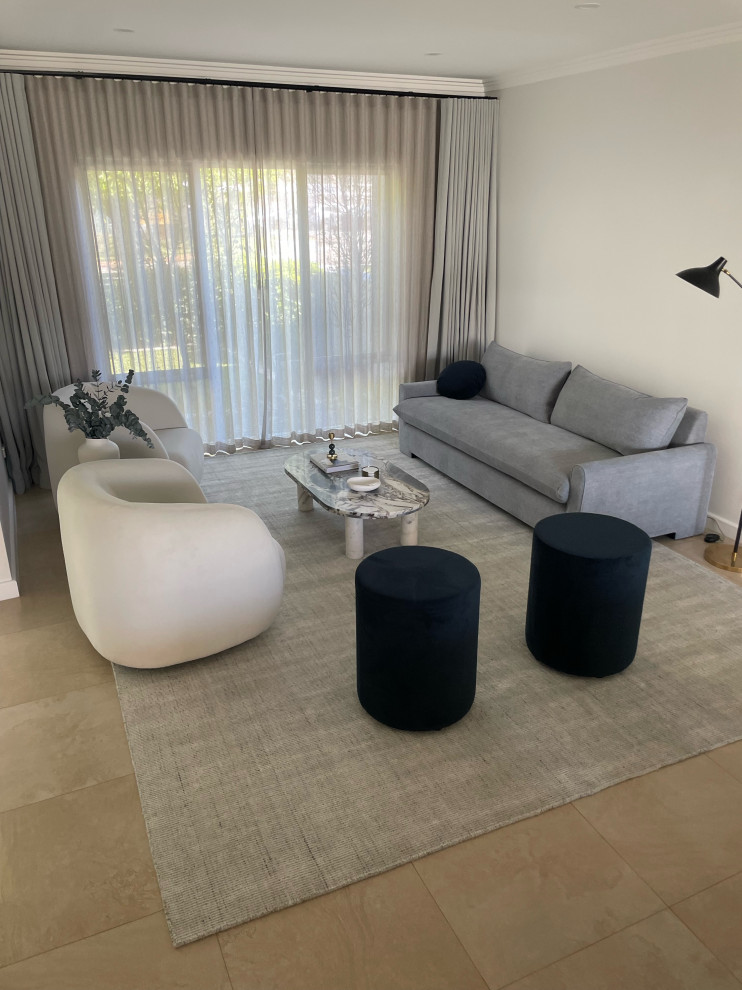 This is an example of a small modern formal open concept living room in Perth with white walls, ceramic floors and no tv.