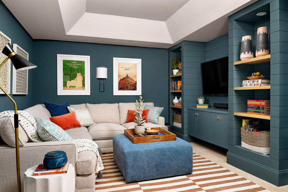 Photo of an eclectic family room in Atlanta with blue walls, carpet, a wall-mounted tv and beige floor.
