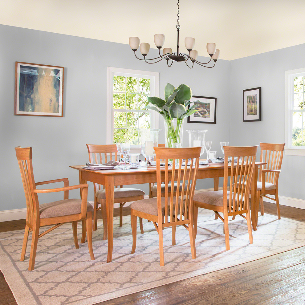 This is an example of a mid-sized traditional kitchen/dining combo in Burlington with blue walls.