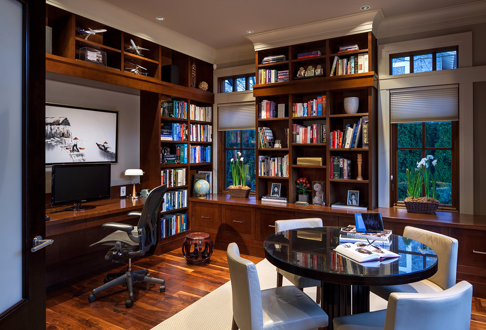 Traditional home office in Vancouver with dark hardwood floors and a built-in desk.