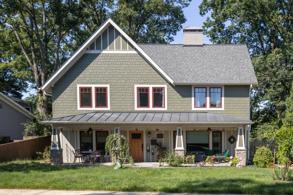This is an example of a mid-sized arts and crafts two-storey green house exterior in DC Metro with mixed siding, a mixed roof, a grey roof and a gable roof.