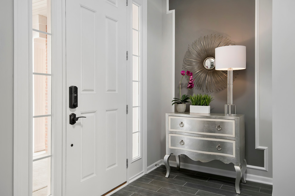 Inspiration for a mid-sized transitional porcelain tile foyer remodel in Chicago with gray walls and a white front door
