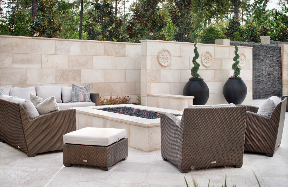 Design ideas for an expansive mediterranean backyard patio in Houston with a fire feature and no cover.