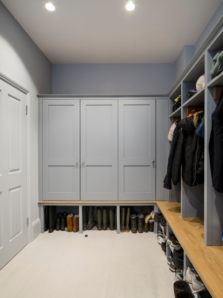 This is an example of a contemporary dressing room in London with shaker cabinets.