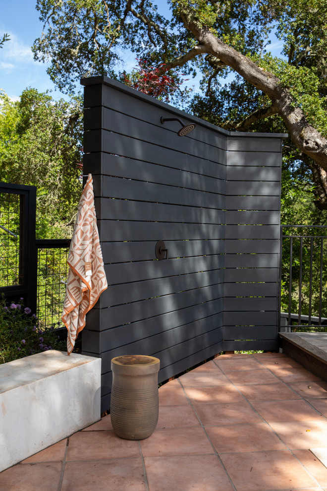 Inspiration for a large mediterranean side yard concrete paver and rectangular infinity pool landscaping remodel in San Francisco