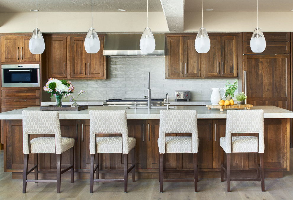 Inspiration for a rustic kitchen remodel in Denver with recessed-panel cabinets and dark wood cabinets