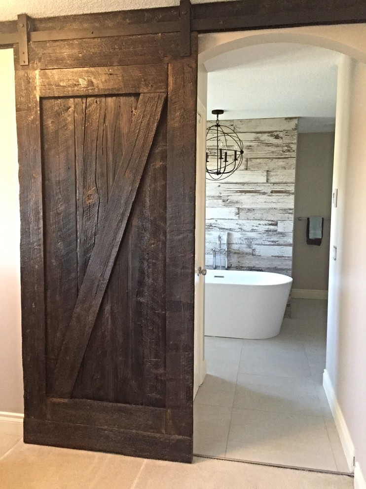 Mid-sized mountain style master gray tile and porcelain tile porcelain tile freestanding bathtub photo in Calgary with shaker cabinets, medium tone wood cabinets, a one-piece toilet, beige walls, a drop-in sink and quartzite countertops