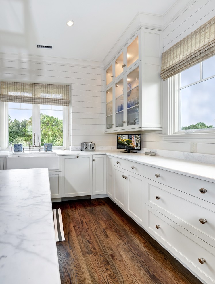 Design ideas for a large beach style u-shaped eat-in kitchen in Charleston with a farmhouse sink, recessed-panel cabinets, white cabinets, with island and stainless steel appliances.