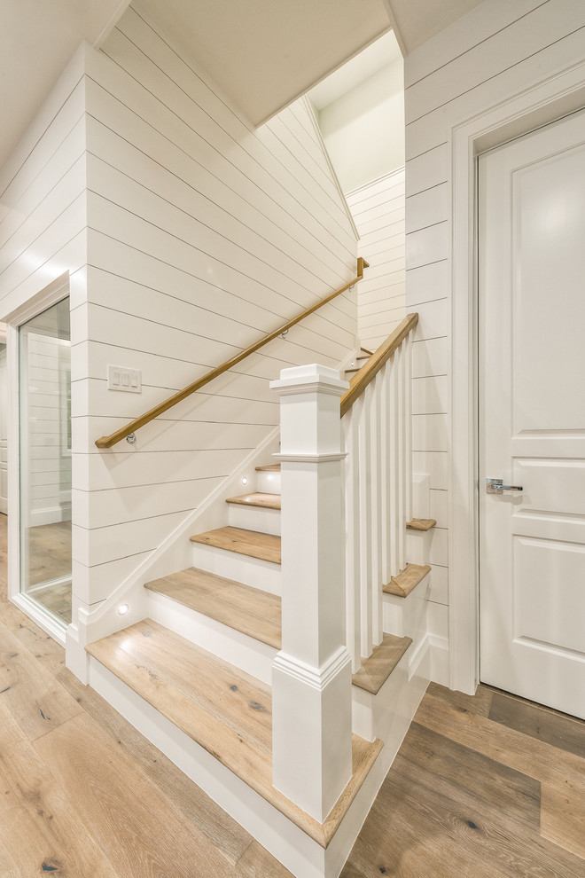 Mid-sized wooden u-shaped wood railing staircase photo with wooden risers