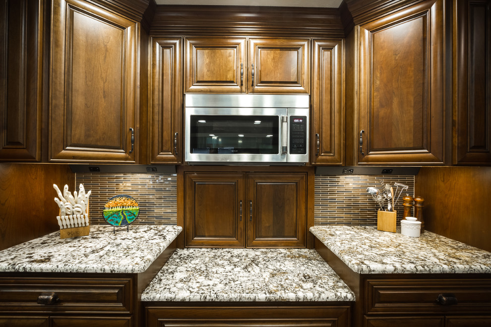 Example of a large transitional l-shaped open concept kitchen design with two islands