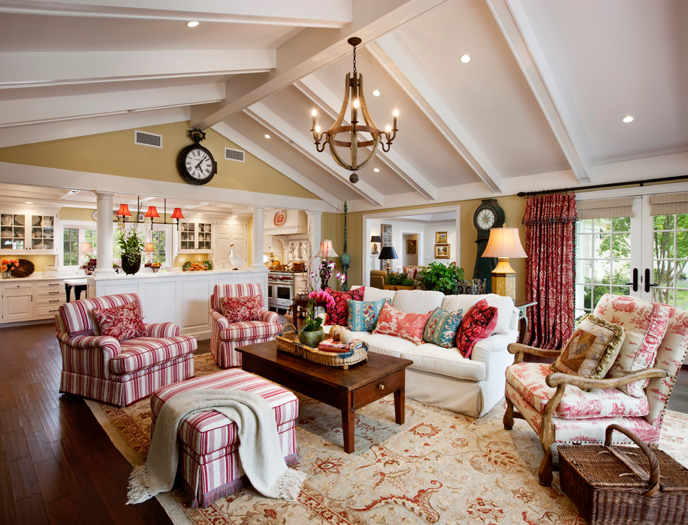 Design ideas for a traditional open concept family room in Santa Barbara with beige walls and dark hardwood floors.