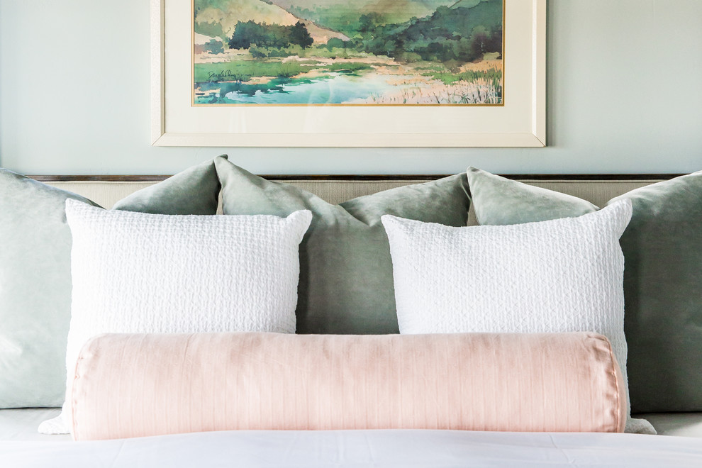 This is an example of a large eclectic master bedroom in Salt Lake City with green walls and painted wood floors.