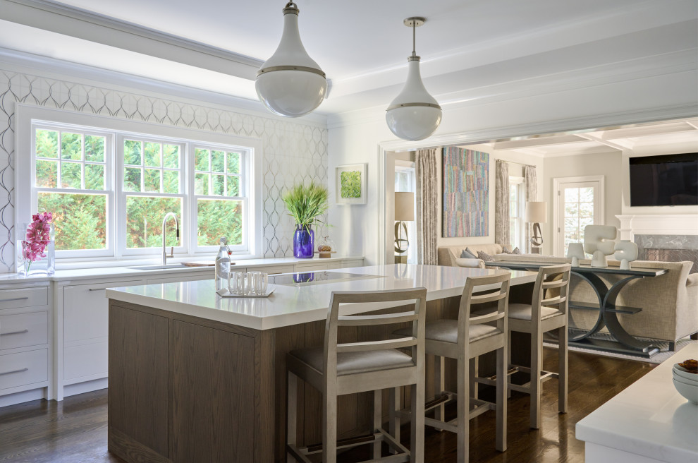 Inspiration for a large transitional u-shaped dark wood floor and brown floor enclosed kitchen remodel in New York with an undermount sink, flat-panel cabinets, white cabinets, quartz countertops, white backsplash, mosaic tile backsplash, stainless steel appliances, an island and white countertops