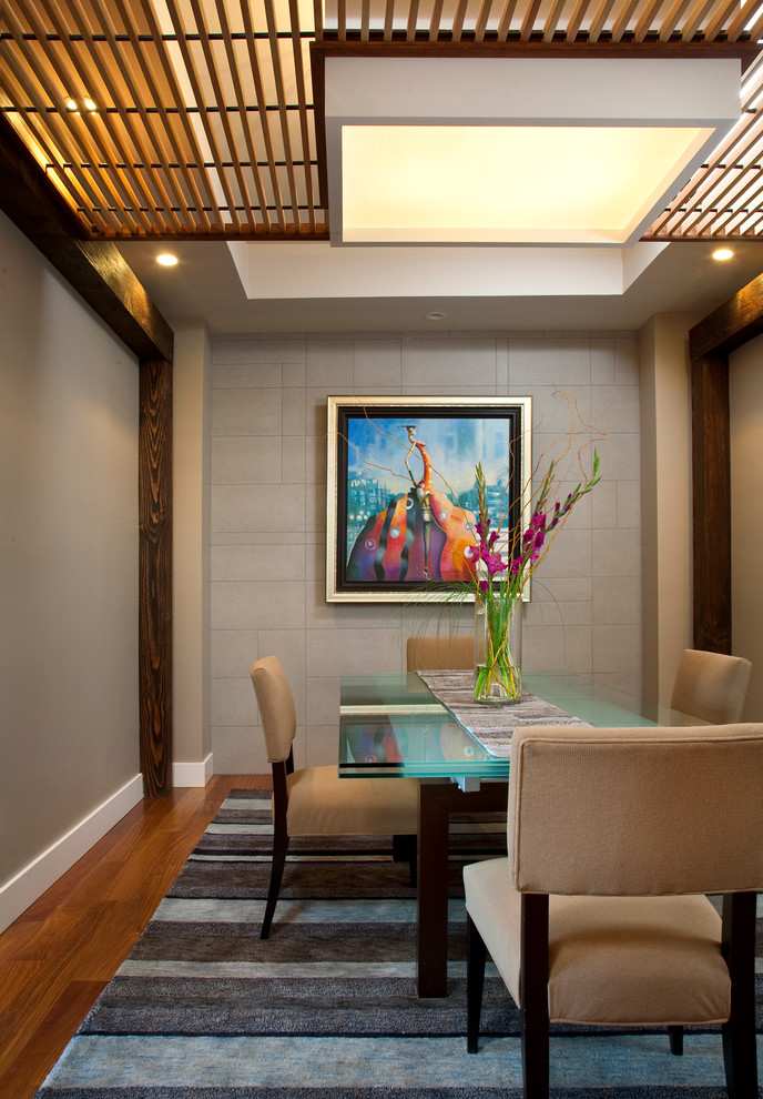 Contemporary separate dining room in San Francisco with grey walls and medium hardwood floors.