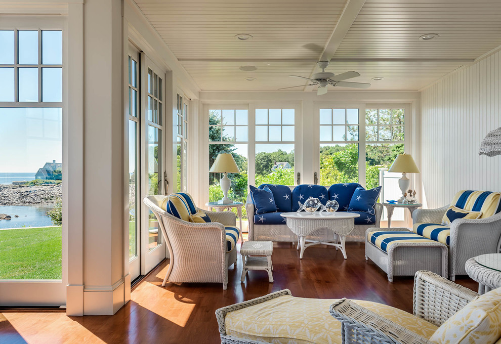Photo of a mid-sized beach style sunroom in Portland Maine with medium hardwood floors and no fireplace.