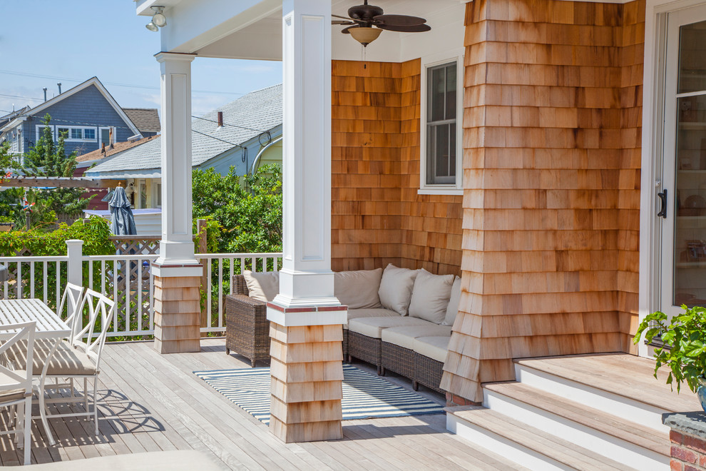 Photo of a beach style deck in New York.