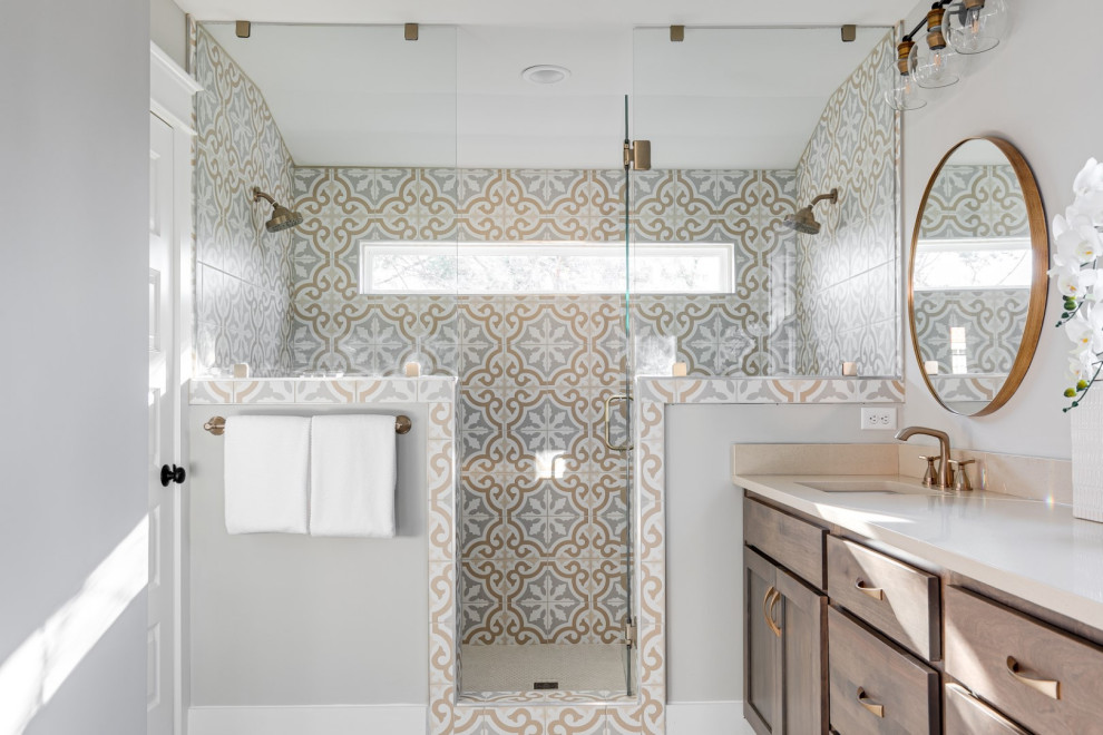 Inspiration for a mid-sized traditional master bathroom in Richmond with recessed-panel cabinets, brown cabinets, a two-piece toilet, multi-coloured tile, ceramic tile, grey walls, light hardwood floors, an undermount sink, engineered quartz benchtops, grey floor, white benchtops, an enclosed toilet, a double vanity, a built-in vanity, a double shower and a hinged shower door.