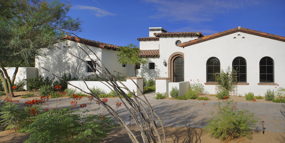 This is an example of a mediterranean one-storey exterior in Phoenix.