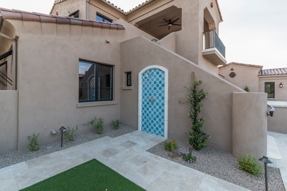 Huge transitional beige two-story stucco house exterior idea in Phoenix with a tile roof