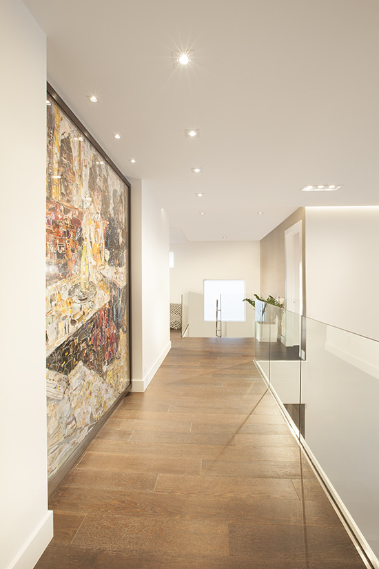 Design ideas for a contemporary hallway in Miami with white walls and porcelain floors.