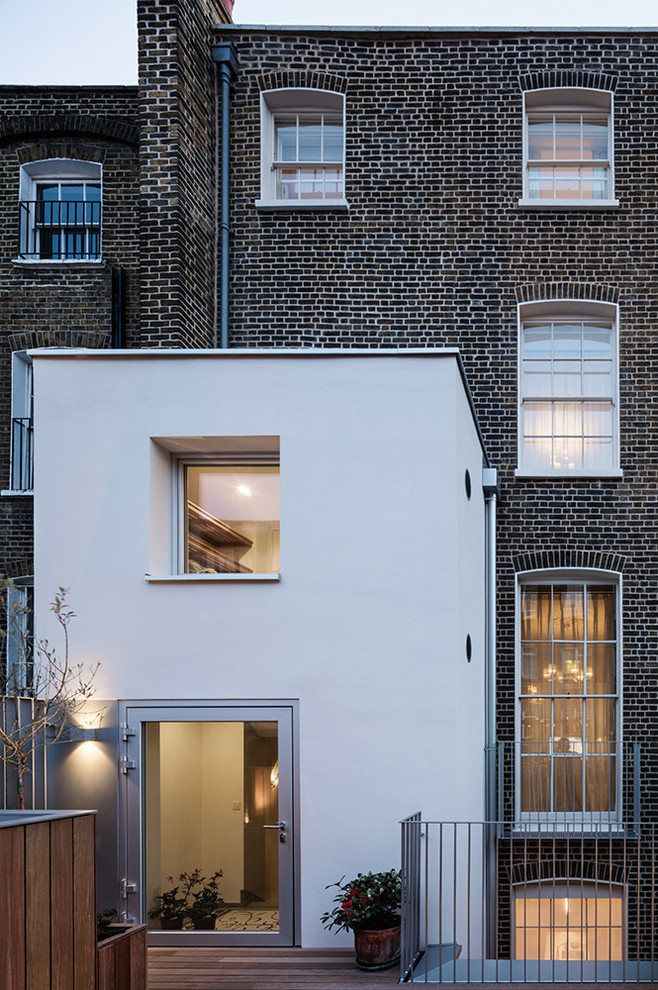 This is an example of a large contemporary brick exterior in London.
