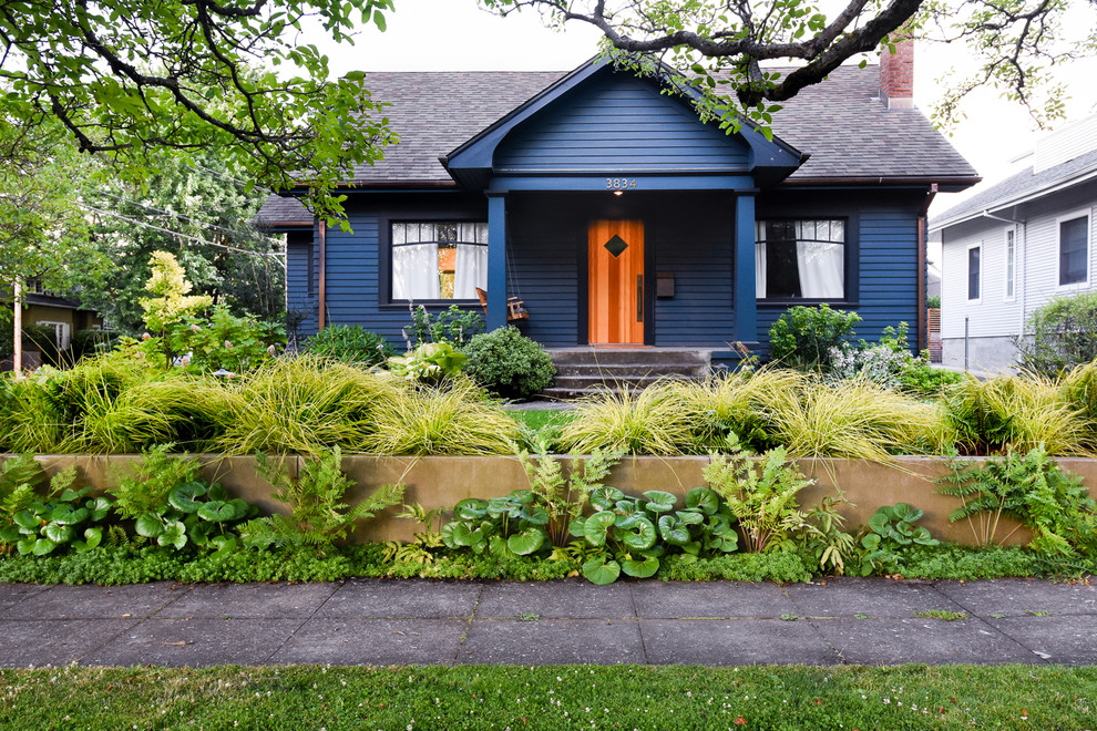 Inspiration for a traditional one-storey blue house exterior in Portland with a gable roof and a shingle roof.