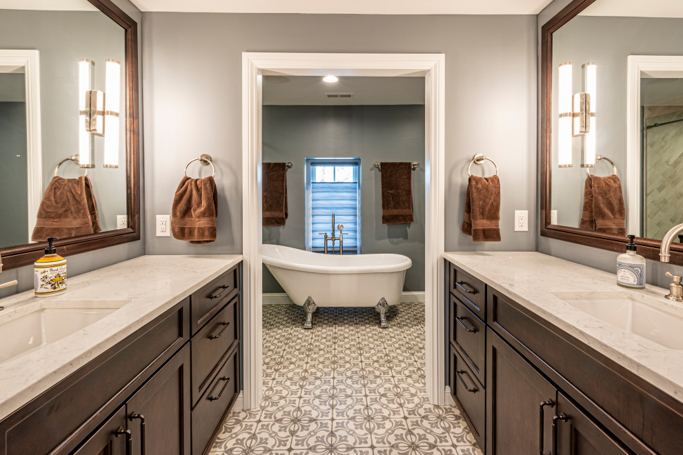 Design ideas for a large traditional bathroom in Denver with shaker cabinets, brown cabinets, a claw-foot tub, an alcove shower, a two-piece toilet, beige tile, porcelain tile, grey walls, terrazzo floors, with a sauna, an undermount sink, engineered quartz benchtops, multi-coloured floor, a sliding shower screen, beige benchtops, a single vanity and a built-in vanity.