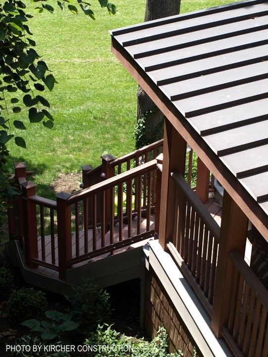 Large arts and crafts backyard deck photo in Cincinnati with a pergola