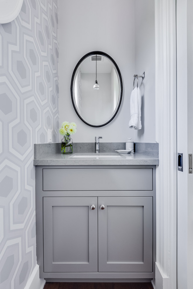Design ideas for a transitional powder room in San Francisco with shaker cabinets, grey cabinets, engineered quartz benchtops, grey walls, medium hardwood floors and grey benchtops.