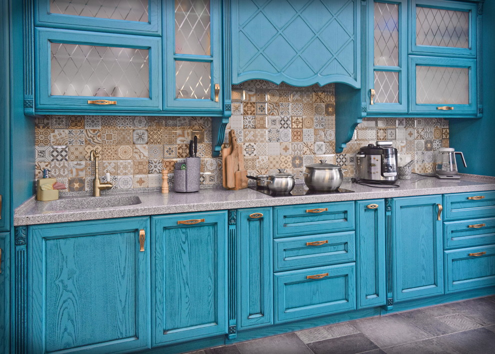 Large eclectic single-wall open plan kitchen in Moscow with an integrated sink, raised-panel cabinets, turquoise cabinets, solid surface benchtops, multi-coloured splashback, ceramic splashback, black appliances, porcelain floors, no island, grey floor and grey benchtop.