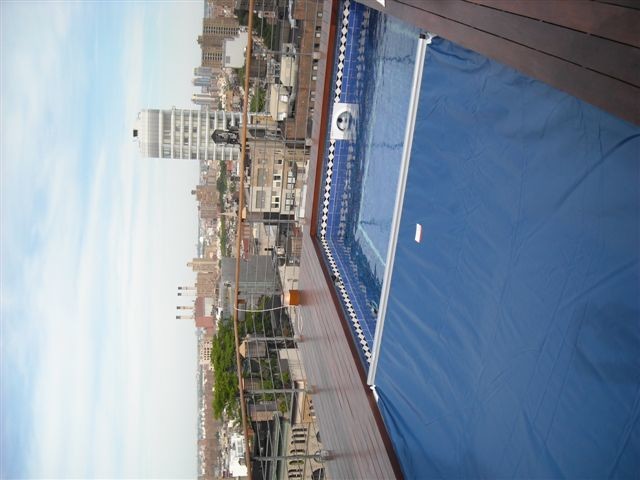 Design ideas for a mid-sized traditional rooftop rectangular lap pool in New York with decking.