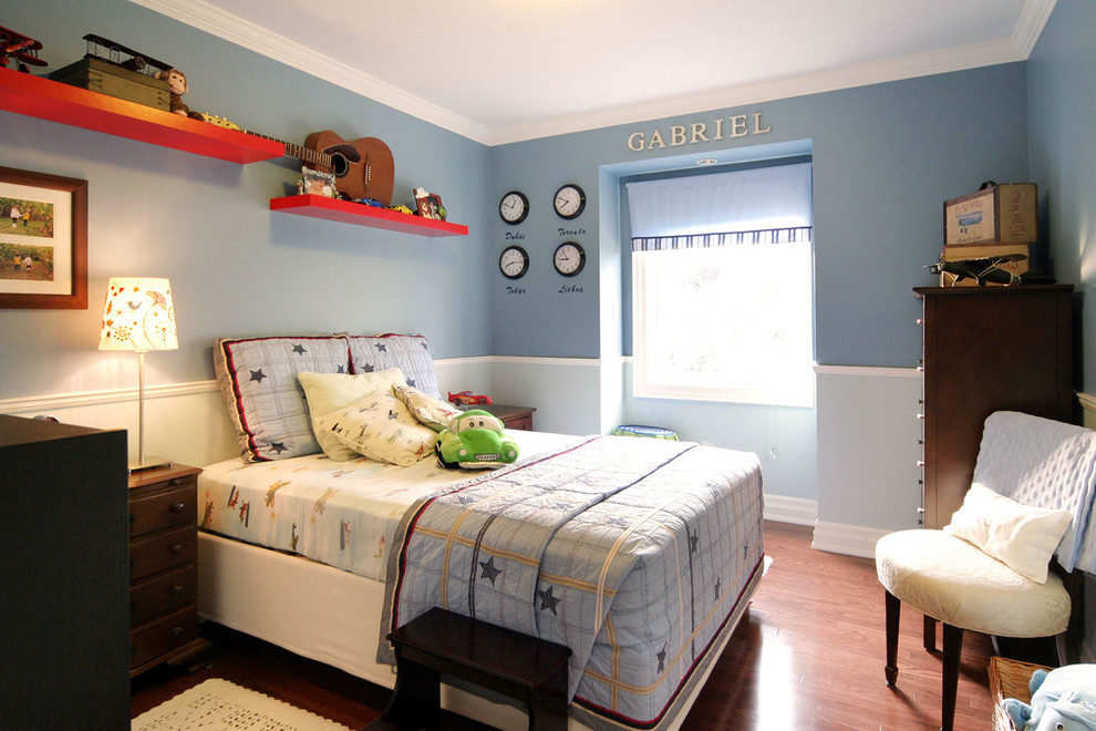 Photo of a contemporary kids' room for boys in Toronto with blue walls.