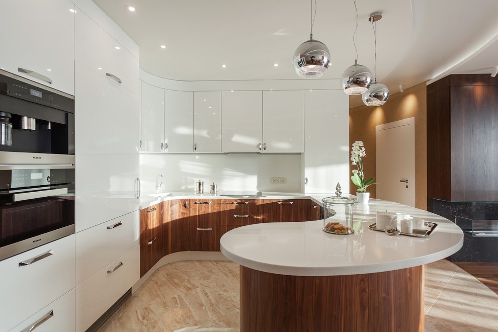 Photo of a contemporary u-shaped open plan kitchen in Yekaterinburg with flat-panel cabinets, white cabinets, white splashback, stainless steel appliances, a peninsula, beige floor, white benchtop and an integrated sink.