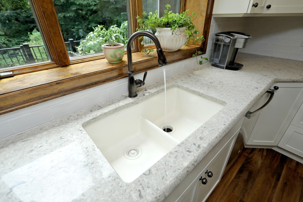 Inspiration for a large transitional kitchen remodel with shaker cabinets, white cabinets, quartz countertops and an island