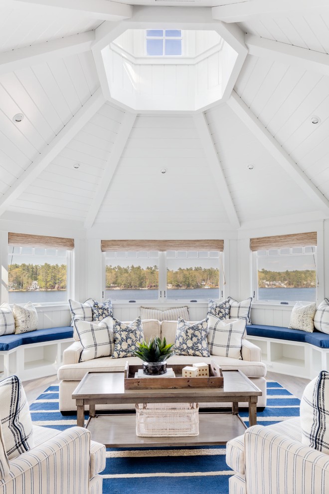 This is an example of a beach style sunroom in Los Angeles with a skylight.