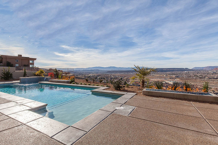 Mid-sized transitional backyard custom-shaped natural pool fountain photo in Las Vegas