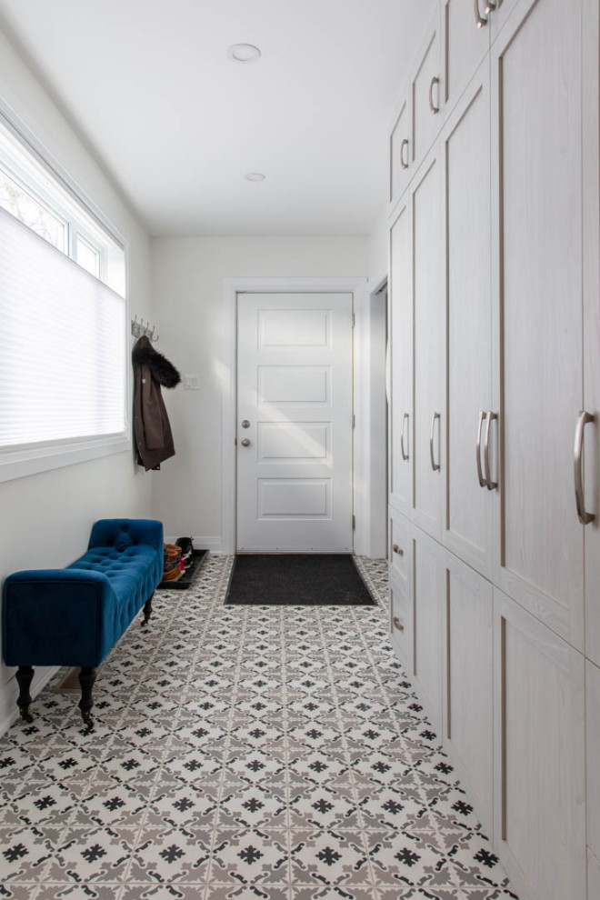 Mid-sized transitional porcelain tile and gray floor mudroom photo in Ottawa with white walls and a white front door