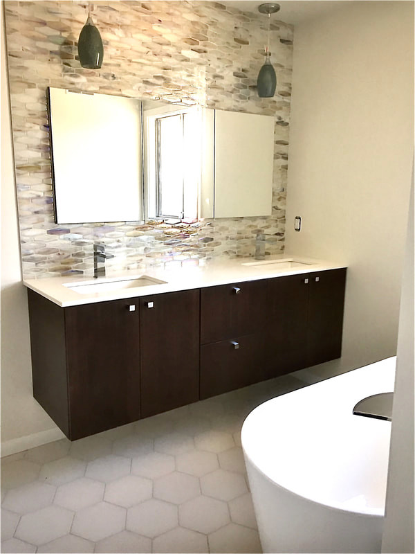 Design ideas for a mid-sized midcentury master bathroom in Grand Rapids with flat-panel cabinets, dark wood cabinets, a freestanding tub, an alcove shower, multi-coloured tile, glass sheet wall, white walls, cement tiles, an undermount sink, quartzite benchtops, white floor, a hinged shower door, white benchtops, a double vanity and a floating vanity.