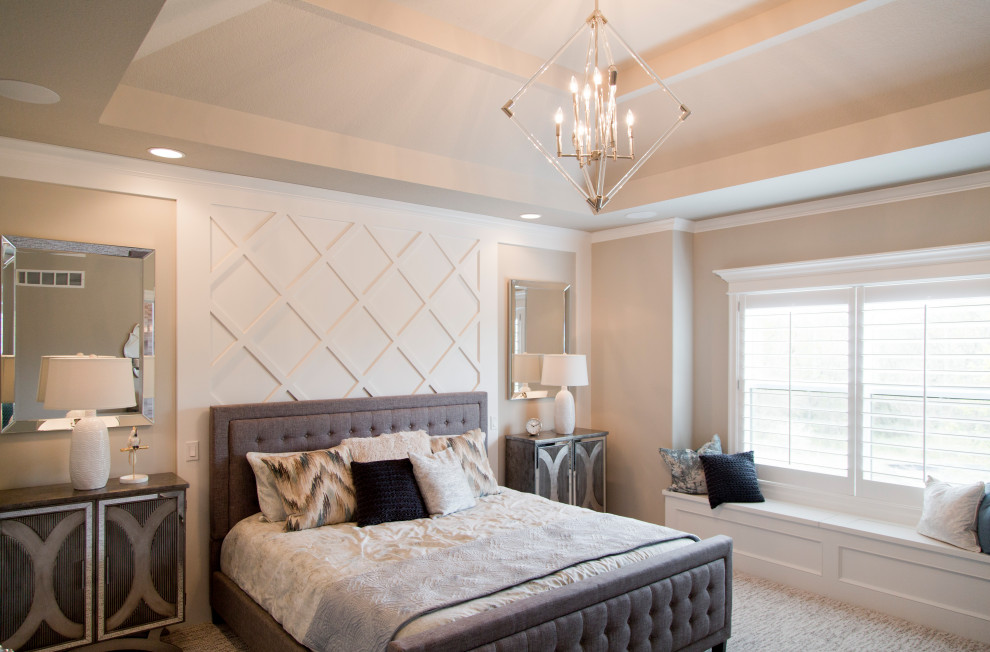 This is an example of a large beach style master bedroom in Kansas City with beige walls, carpet, beige floor and recessed.