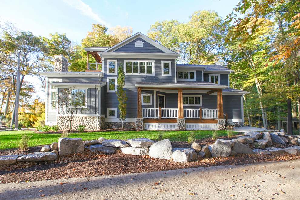 Kennedy Lake House - Every inch of this exquisite Lake Michigan home was thought through in great detail. Every element has a meaning or memory associated to it.  So Cottage Home was honored to build this incredible home for clients who were well educated in what they wanted, appreciated the high level of quality and detail in every element, and were simply a true joy to work with throughout the building process. High-end finishes of granite and quartz countertops, stainless appliances, custom built and finished cabinetry and paint details, quarter-sawn white oak floors, and high-end finishes. The exterior is SmartSide siding and trim details, custom built and finished cedar details, Pella windows, and maintenance free rail systems. This home was given the LEED for Homes GOLD award. Cottage Home is the premiere builder on the shore of Lake Michigan, between the Indiana border and Holland.